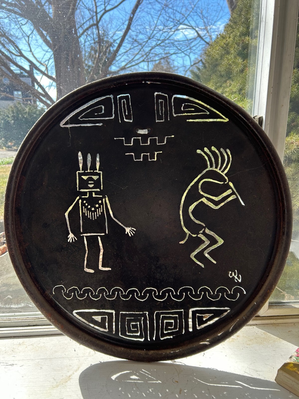 Rustic round cut metal Navajo wall hanging with Kokopelli and Yei