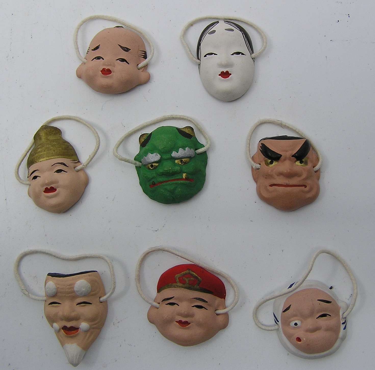 Lot of 8 Miniature Hand Painted Ceramic Masks ~ 1 1/8″ Tall ~ No Signature
